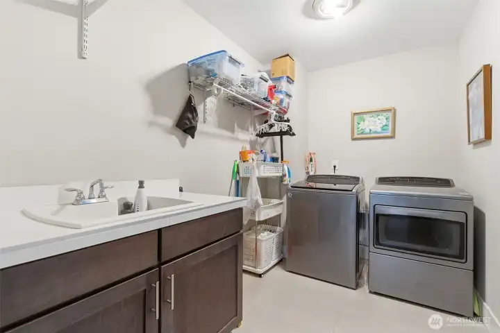 The upper-level laundry room offers convenience and efficiency, making household chores easier to manage.
