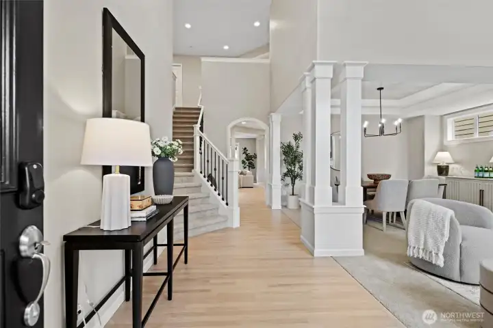 Grand 2 story entry way leaving a lasting impression with views all the way to the back of the home. Refinished hardwood floors, new paint throughout, new carpet throughout, and elegant millwork.
