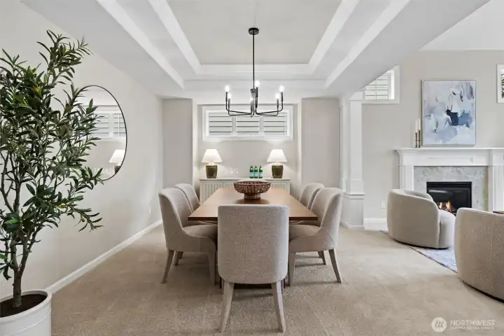 Dining room with coffered ceilings and new fixtures.