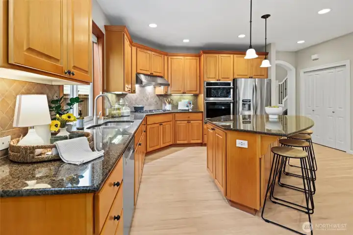 Large granite island, updated appliances - gas Thermador cooktop and convection oven/microwave. Refinished hardwoods & paint/carpet throughout.