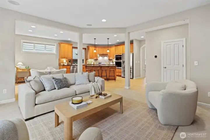 Kitchen flows seamlessly into family room with 2nd gas fireplace, built-in cabinetry perfect for storage, and pre-wired in ceiling speakers