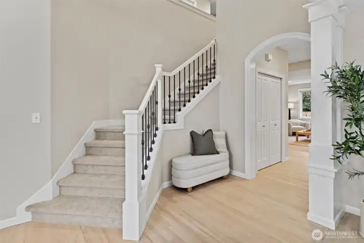 Beautiful sweeping staircase to upstairs with 4 of 5 bedrooms and large bonus/rec room. New carpet/paint/refinished hardwoods throughout.
