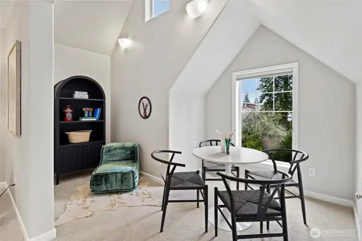 Upstairs bonus room with additional seating nook and plenty of space for movie nights, game nights, and more!