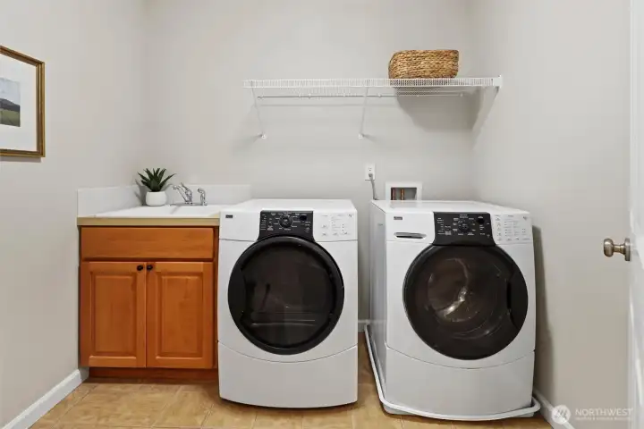 Upstairs laundry room with utility sink