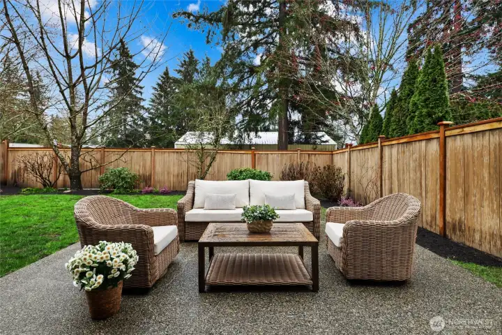Peaceful fully fenced backyard with curated plants & fruit trees. Grass has been recently seeded. Additional covered area with pine for storing BBQ.