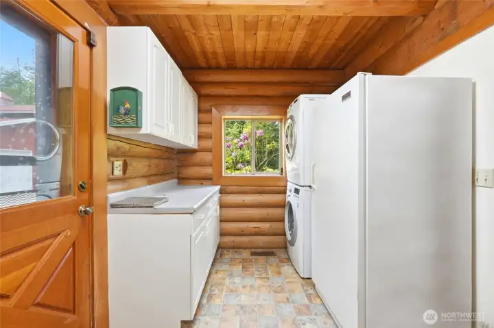 Laundry and side door exit, located behind kitchen.