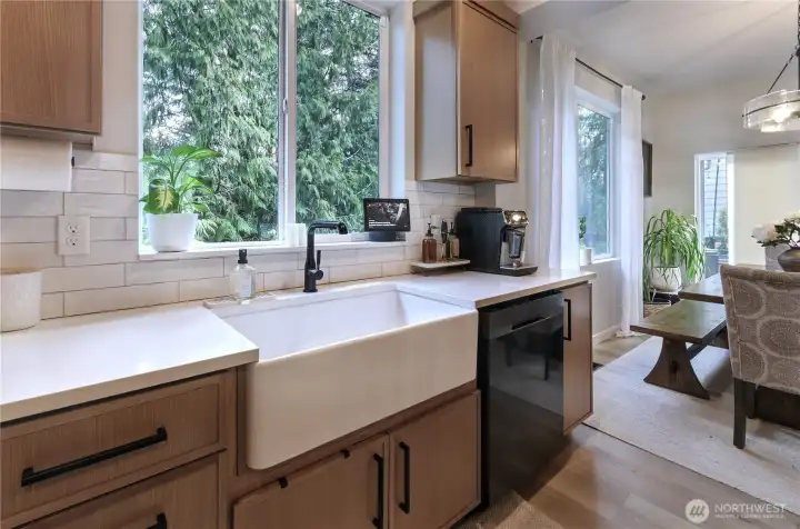 Another view of the kitchen and greenbelt