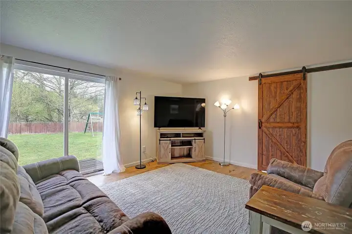 A slider off of the living room leads out to the fenced backyard.