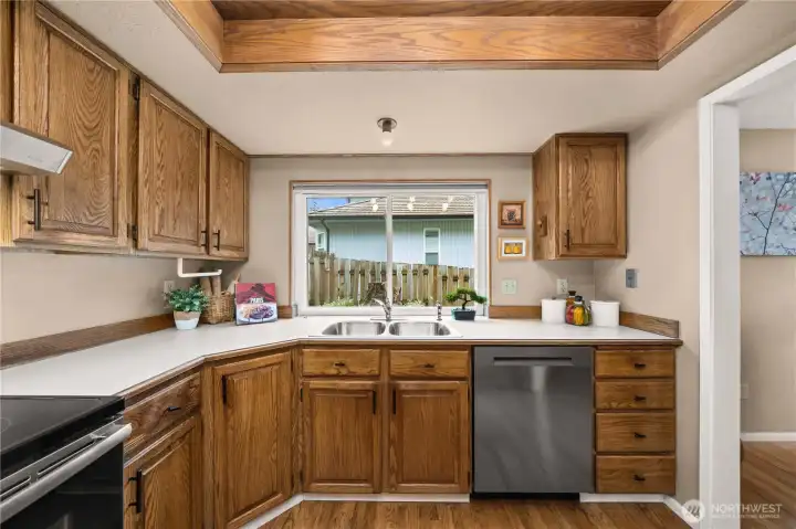 Kitchen has plenty of cabinet space and newer appliances.