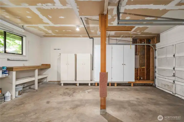 2 car garage with loads and loads of cabinet storage