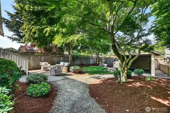 Cozy and fenced backyard with carport/garage and alley access