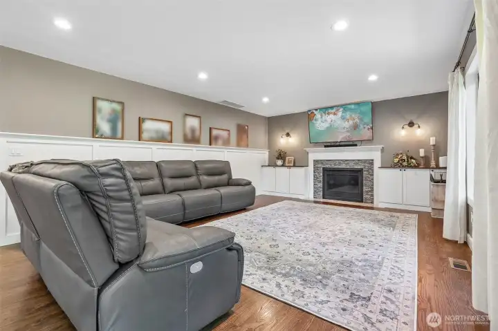 Large living room with gas fireplace and waynes molding