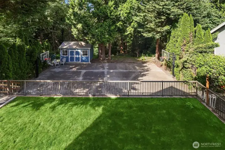 Grass, then a sport court and a shed. • 11,850 Square Foot Lot (0.272 Acres)