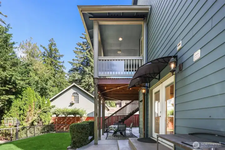 Looking up from lower level to the covered patio.  Notice the details such as the covered lower door.