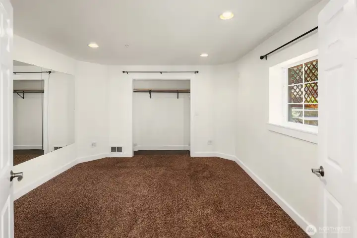 Lower level bedroom has closet doors off for now.  They're in another closet being stored.