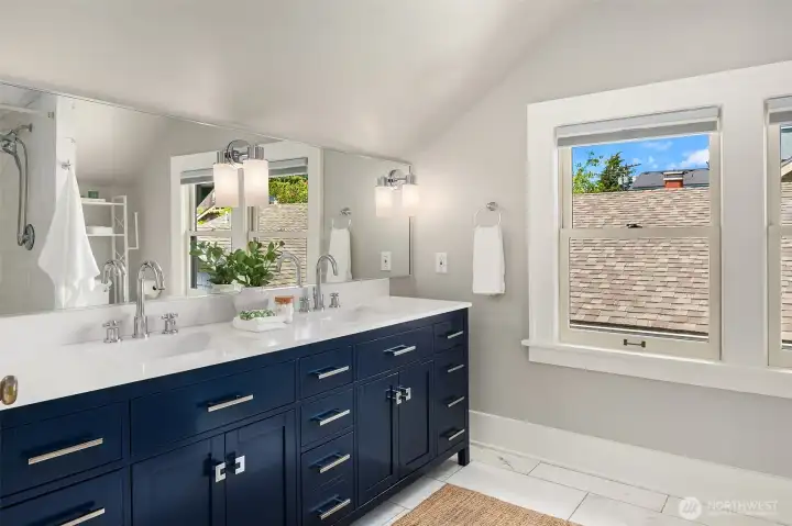 Upstairs offers an updated bath with double vanity and marble details. Upstairs offers an updated bath with double vanity and marble details.