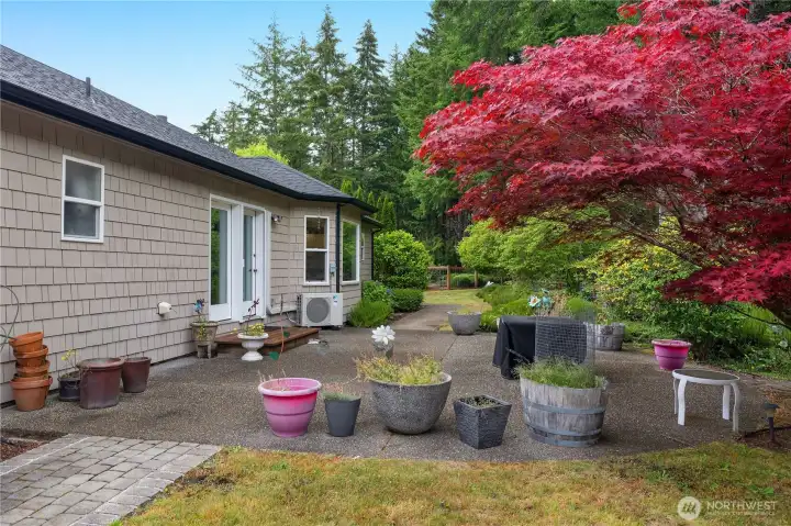 Just outside the great room, a spacious patio offers seamless indoor-outdoor living with beautiful garden views. Just outside the great room, a spacious patio offers seamless indoor-outdoor living with beautiful garden views.