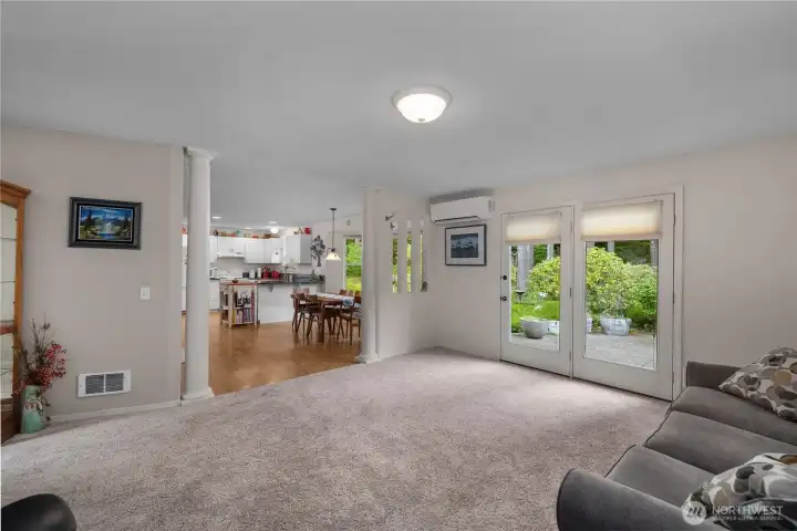Open-concept living area flows seamlessly into the dining room and kitchen. Open-concept living area flows seamlessly into the dining room and kitchen.