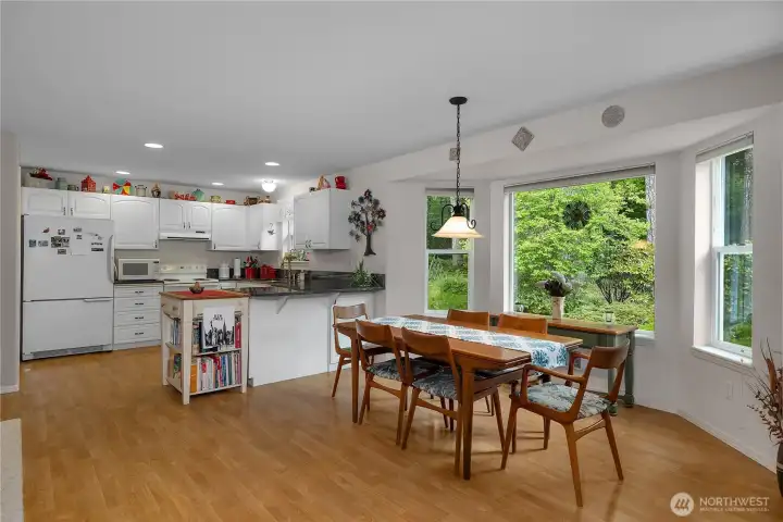Enjoy meals with peaceful garden views in this bright gathering space. Enjoy meals with peaceful garden views in this bright gathering space.
