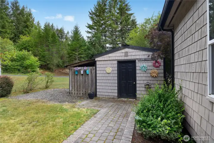 Storage shed with covered side area provides convenient space for lawn equipment, tools, and outdoor storage. Storage shed with covered side area provides convenient space for lawn equipment, tools, and outdoor storage.