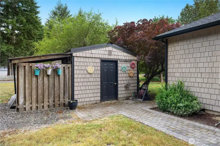 Additional view of the storage shed and paved garden pathways for easy outdoor access. Additional view of the storage shed and paved garden pathways for easy outdoor access.