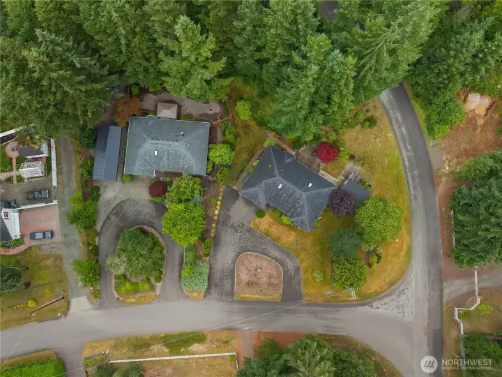 Bird's-eye view highlights the home's desirable location within an established neighborhood surrounded by trees. Bird's-eye view highlights the home's desirable location within an established neighborhood surrounded by trees.