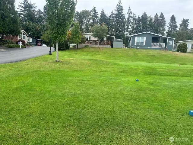 The lovely home is the one on the left, from the beautiful golf course.