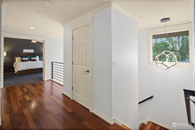 Upper level foyer looking toward primary bedroom.