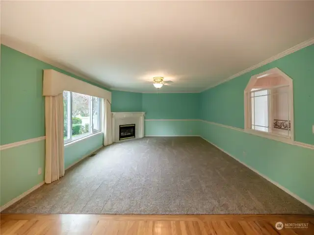 Large family room with gas fireplace and custom mantel