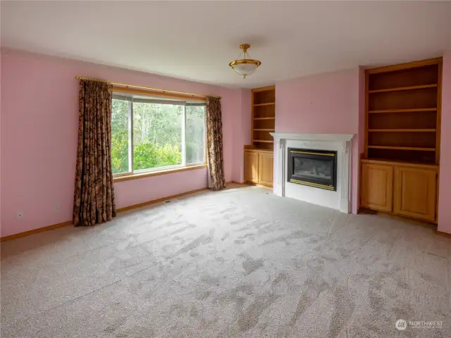 Bonus room with custom built-in's and gas fireplace with custom mantel