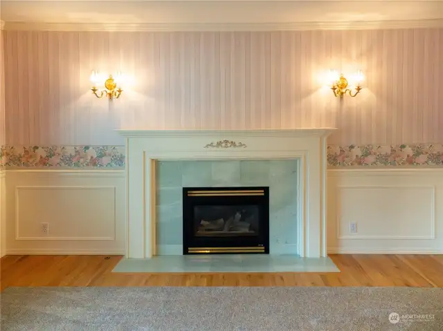 Sconce Lighting adorns fireplace with custom mantel