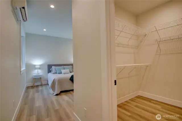 Entry to the Primary Suite with Walk-in Closet to the right.