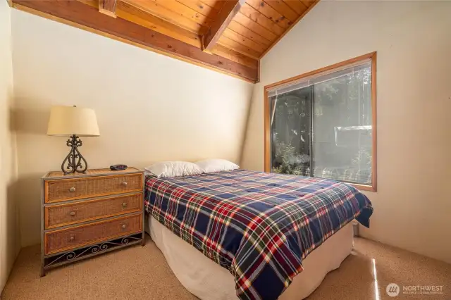 Upstairs bedroom with vaulted ceilings