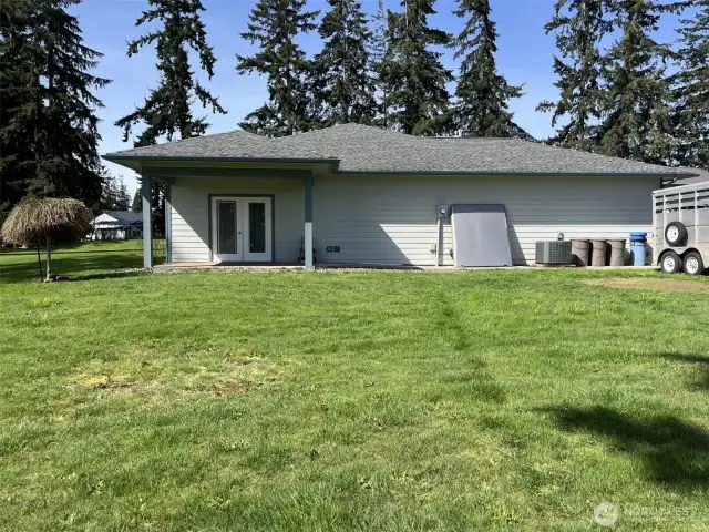 Side of home, french doors with patio