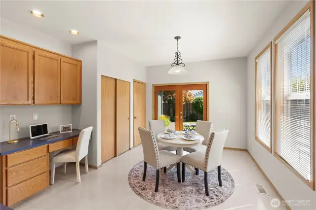 Pictured in the dining area is the office space, large pantry space, and door that leads to the upstairs great room.