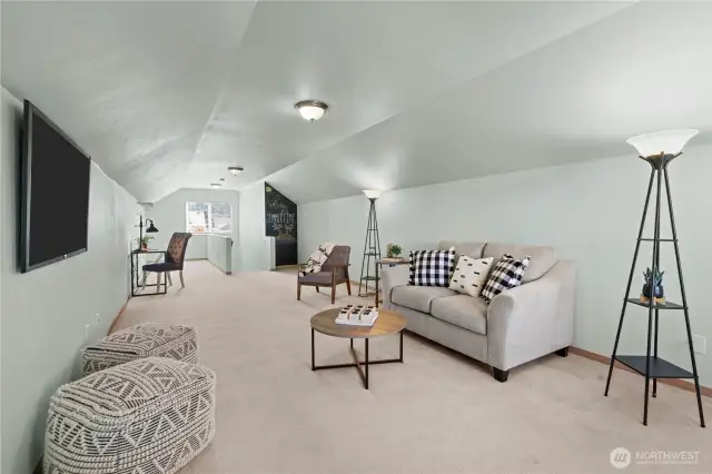 Upstairs great room runs the whole length of the house