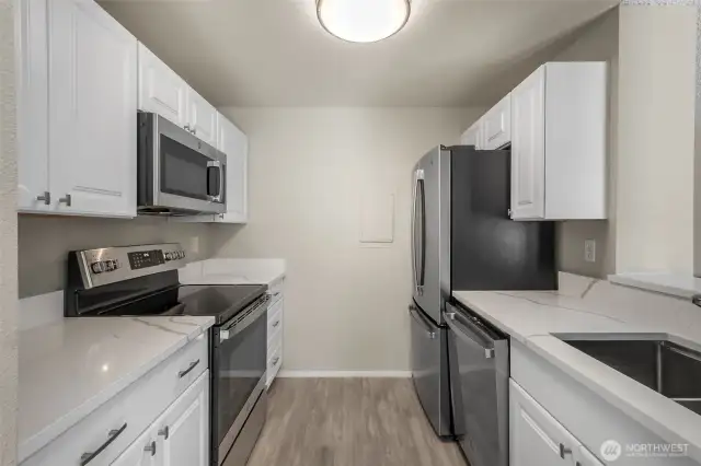 New cabinets, quartz, ss appliances, sink and fixture, vinyl-plank flooring-just completed.