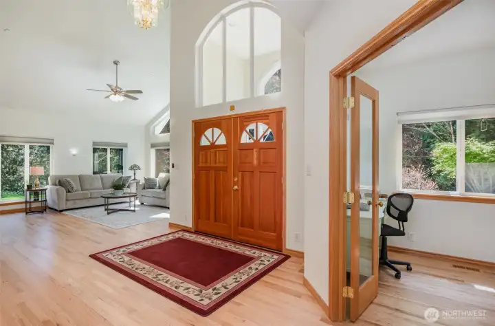 Home enters to soaring 16 foot vaulted ceilings with natural light pouring in from every direction.