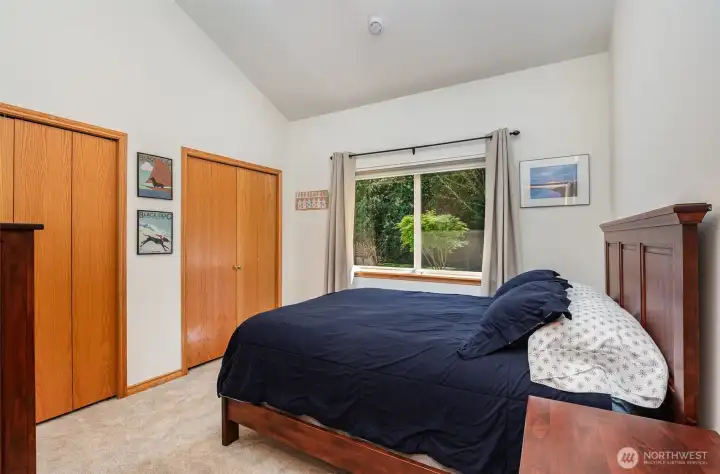 Guest bedroom #1 with dual closets.