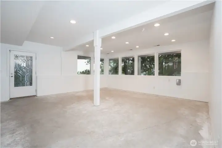 Basement level Studio or? Not pictured, is a long stainless counter and sink.