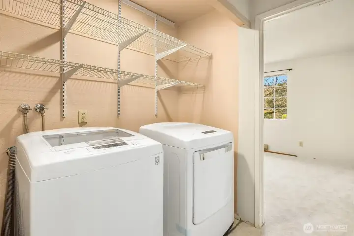 2nd level laundry area with newer washer and dryer