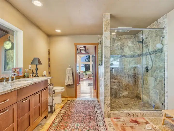 Custom granite and tile shower and bathroom built by local company to unwind after a full day of living.