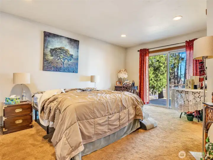 Ensuite bedroom with sliding glass door to porch.