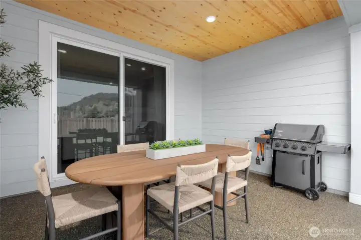 Large, covered patio with pine ceiling and gas hook up.  All pictures are of actual home.