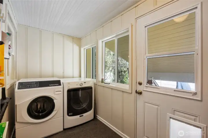 main floor laundry, leads out to patio