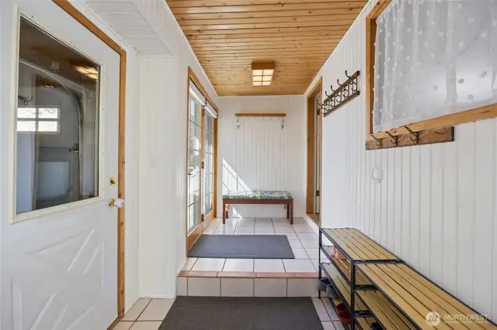 hallway to family room has door to garage and door to driveway