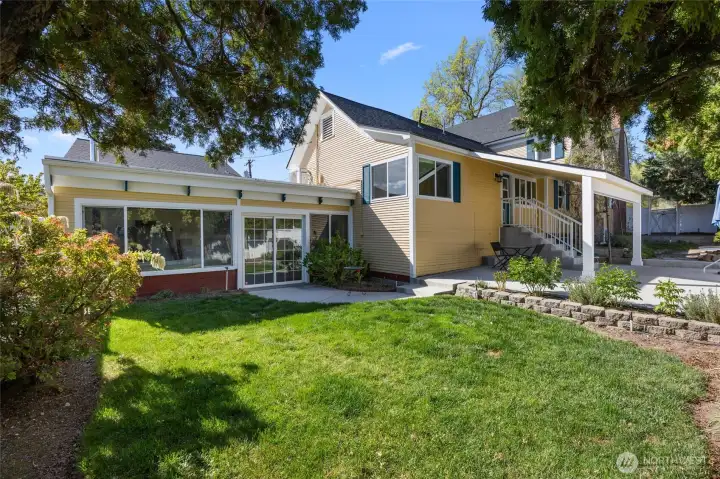 side patio and yard off family room