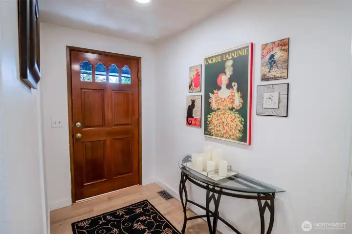 As you enter you will find beautiful engineered wood floors that flow throughout the home