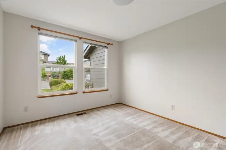 Dedicated laundry room with access to garage and back deck.