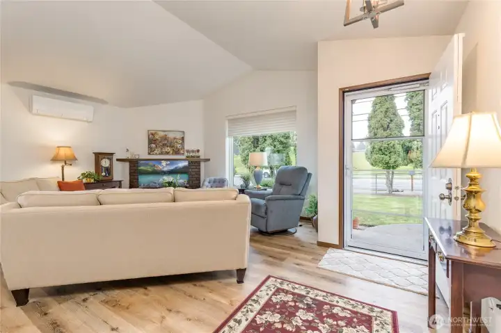 This vaulted entry perfectly connects indoor comfort with the green space of the park just steps away.